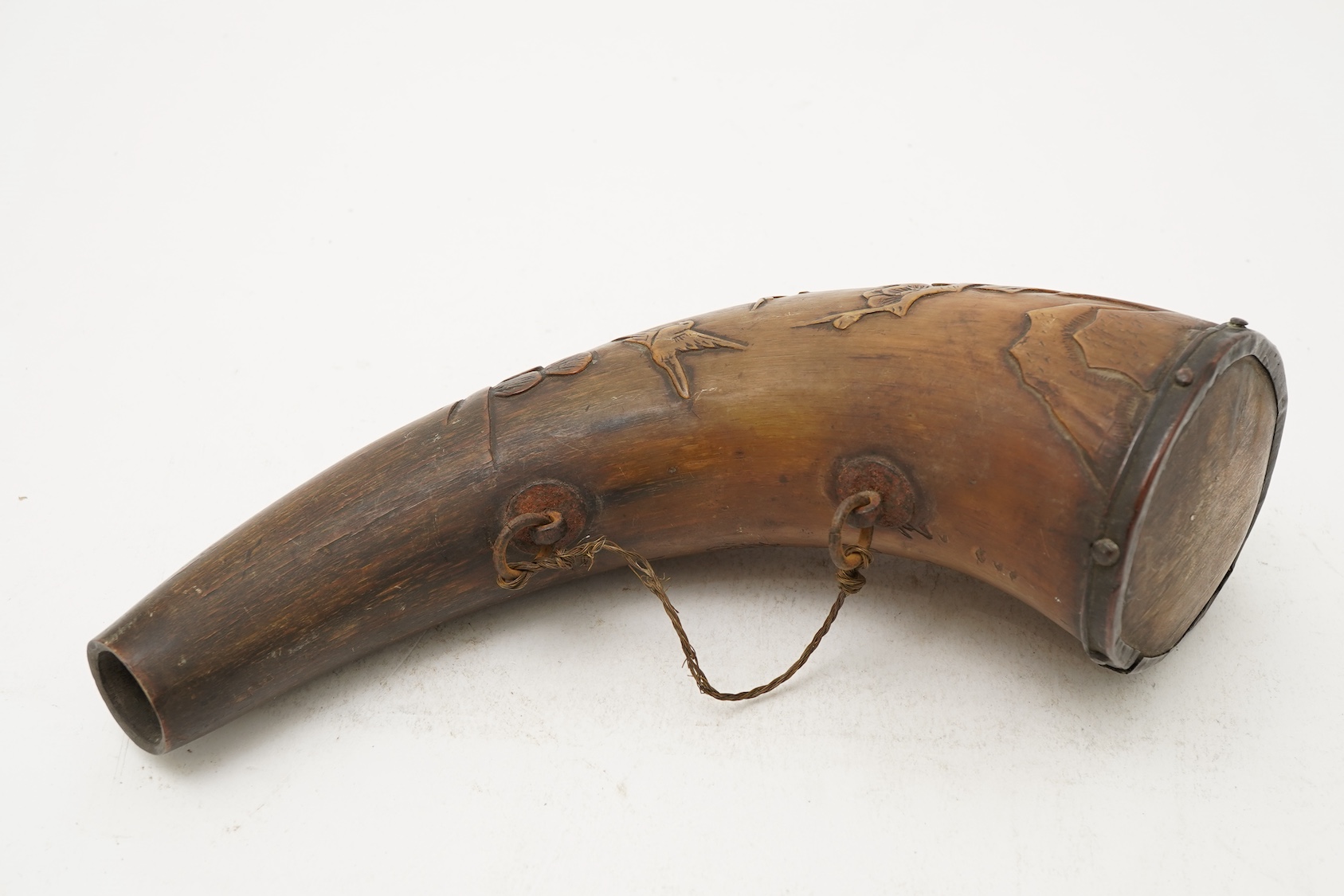 A Tibetan or Mongolian inscribed buffalo horn powder flask, 18th century